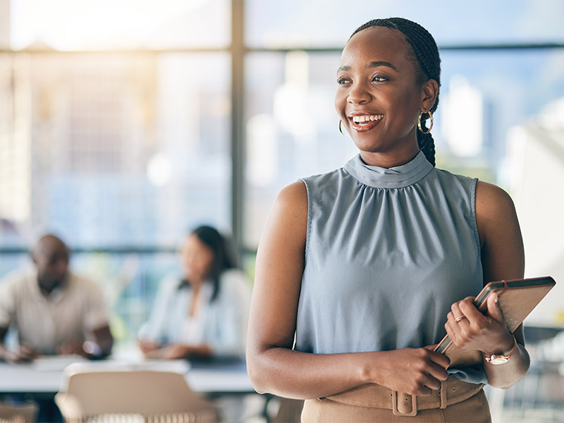 woman holding planner in corporate office