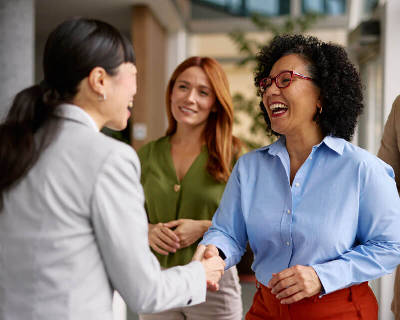 Professional women shaking hands